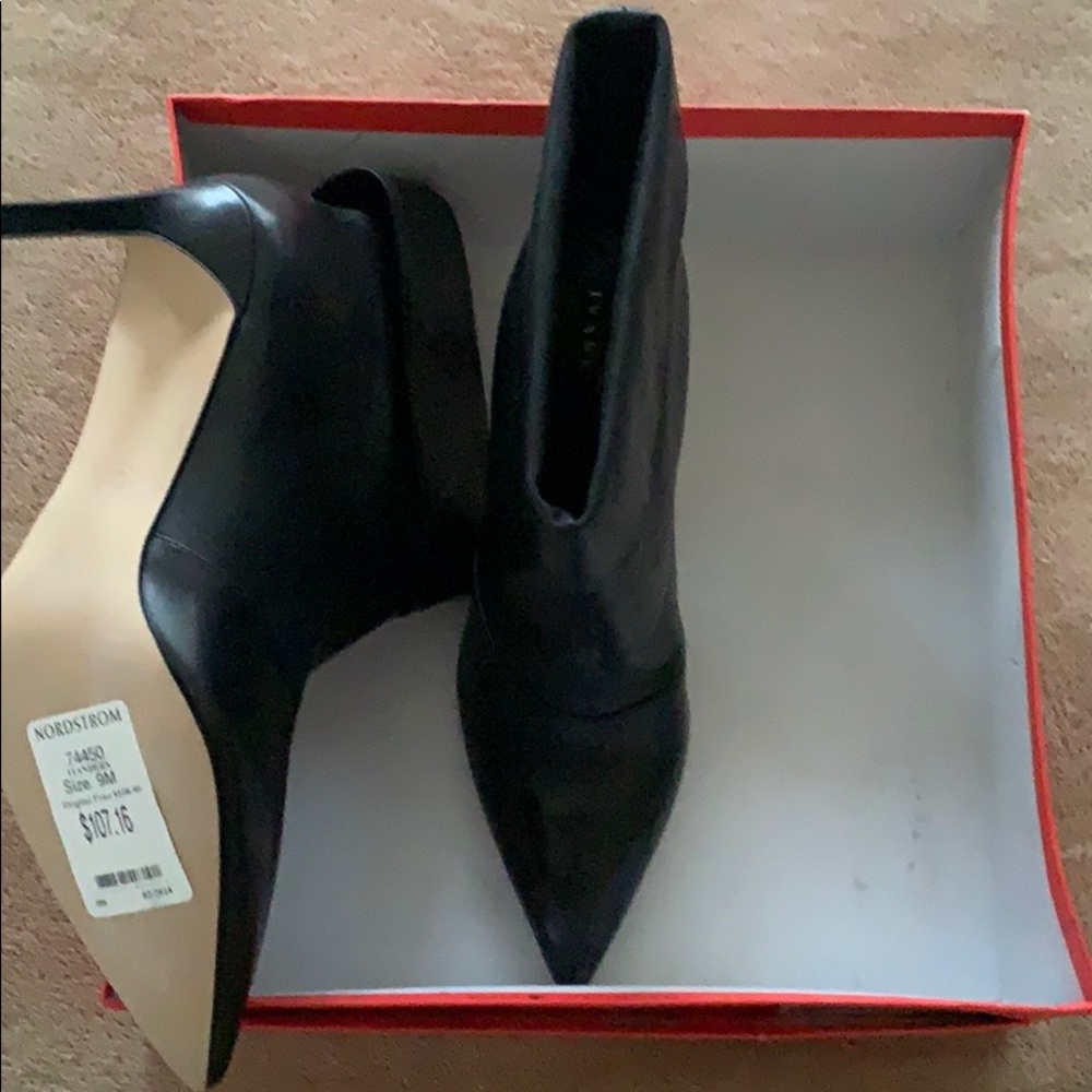 Ivanka Trump black leather boots